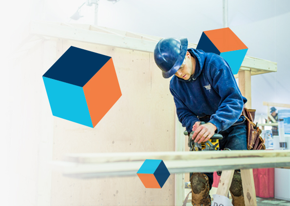 A carpenter competing at the Nova Scotia Skills Competition. Skill cubes floating in the air surround him.